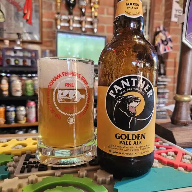 Photography showing a Panther Brewery pint being served