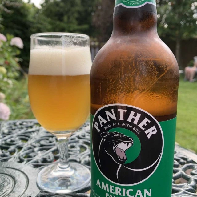 Customer picture of Panther American Pale Ale bottle next to poured glass
